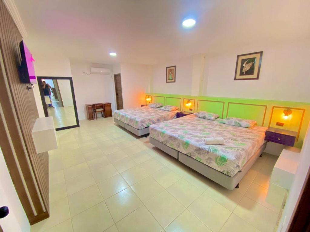 Postel nebo postele na pokoji v ubytování Hostal Marle