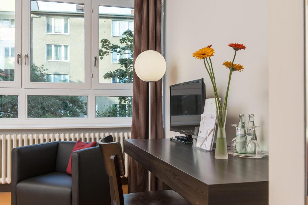 TV a/nebo společenská místnost v ubytování Hotel Grenzfall