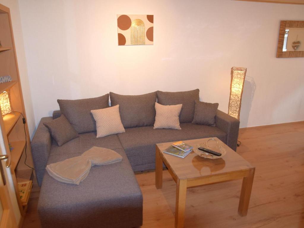 a living room with a couch and a coffee table at Holiday home in Wilsecker with private terrace 