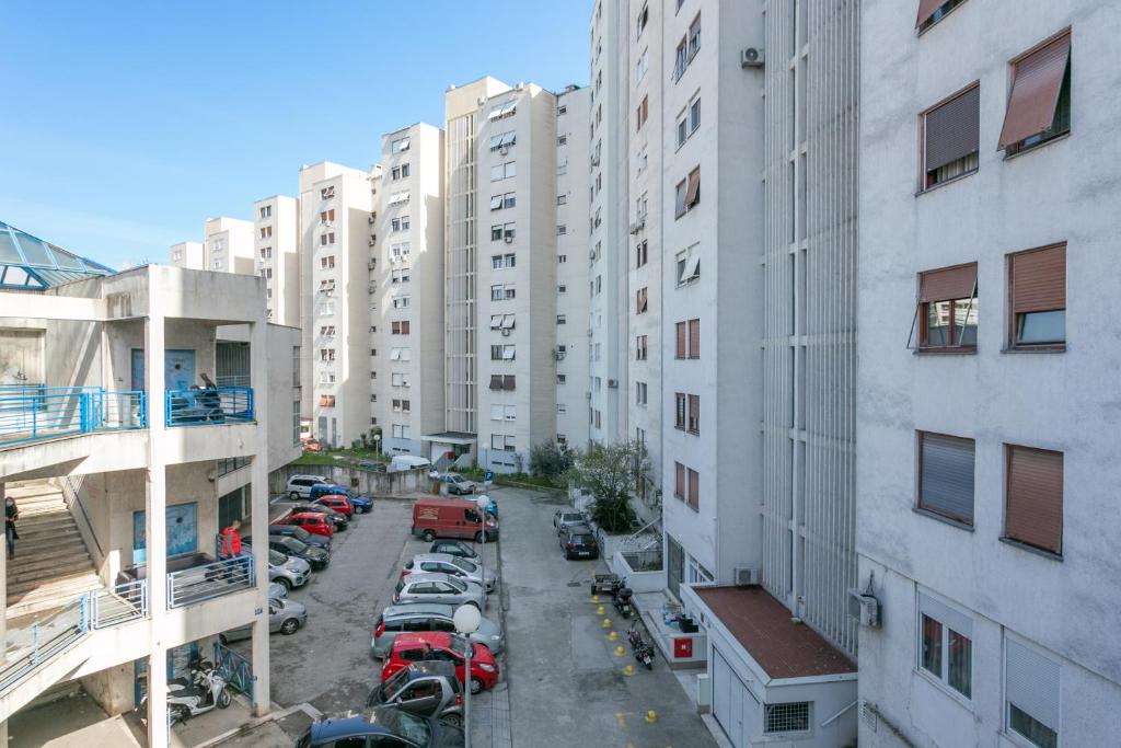 an aerial view of a city street with tall buildings at Apartments with a parking space Split - 22452 in Split