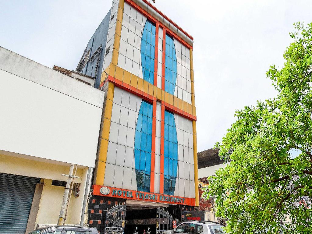 a building with colorful windows on the side of it at Hotel Tejasri Residency in Vijayawāda