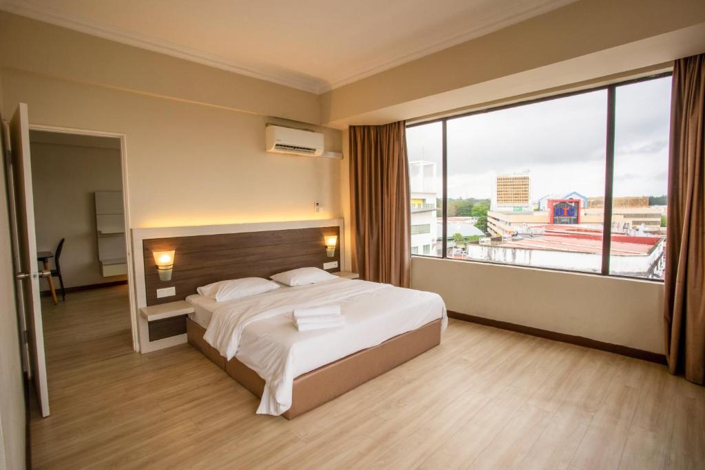 Postel nebo postele na pokoji v ubytování Somerset Hotel