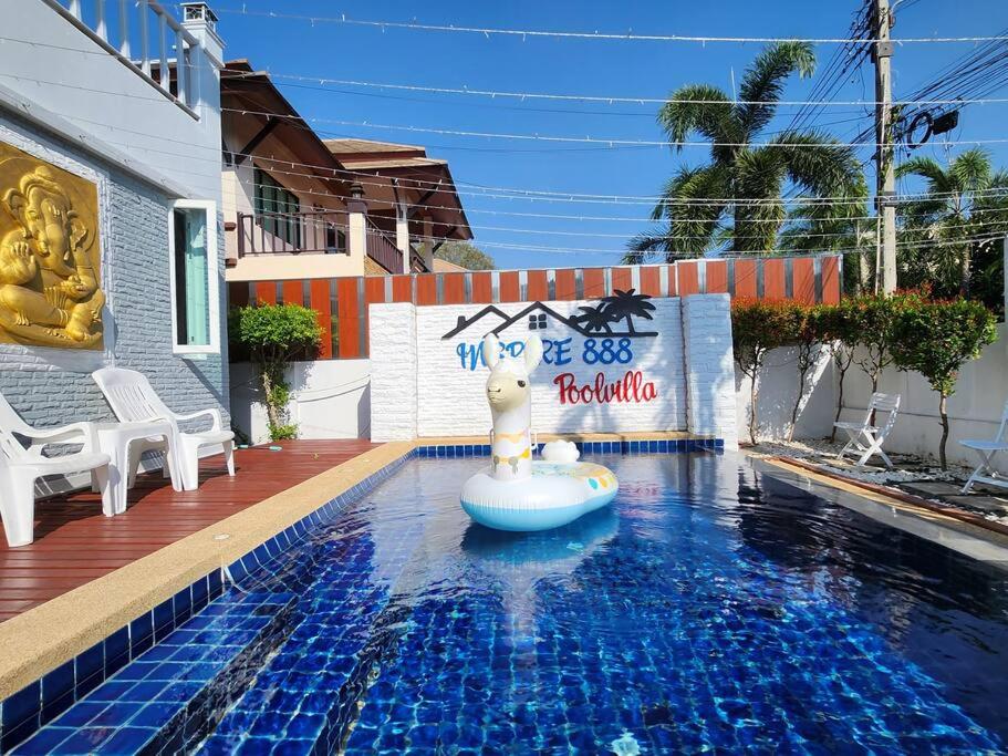 a pool with a hello kitty sign in the water at D34长住优惠房-芭提雅市中心高端4间卧室泳池别墅 in Pattaya Central