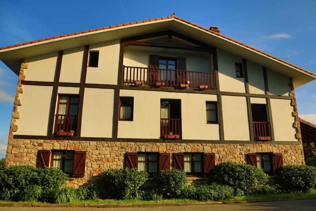 a large building with windows and a balcony at Gane Landetxea in Barrika