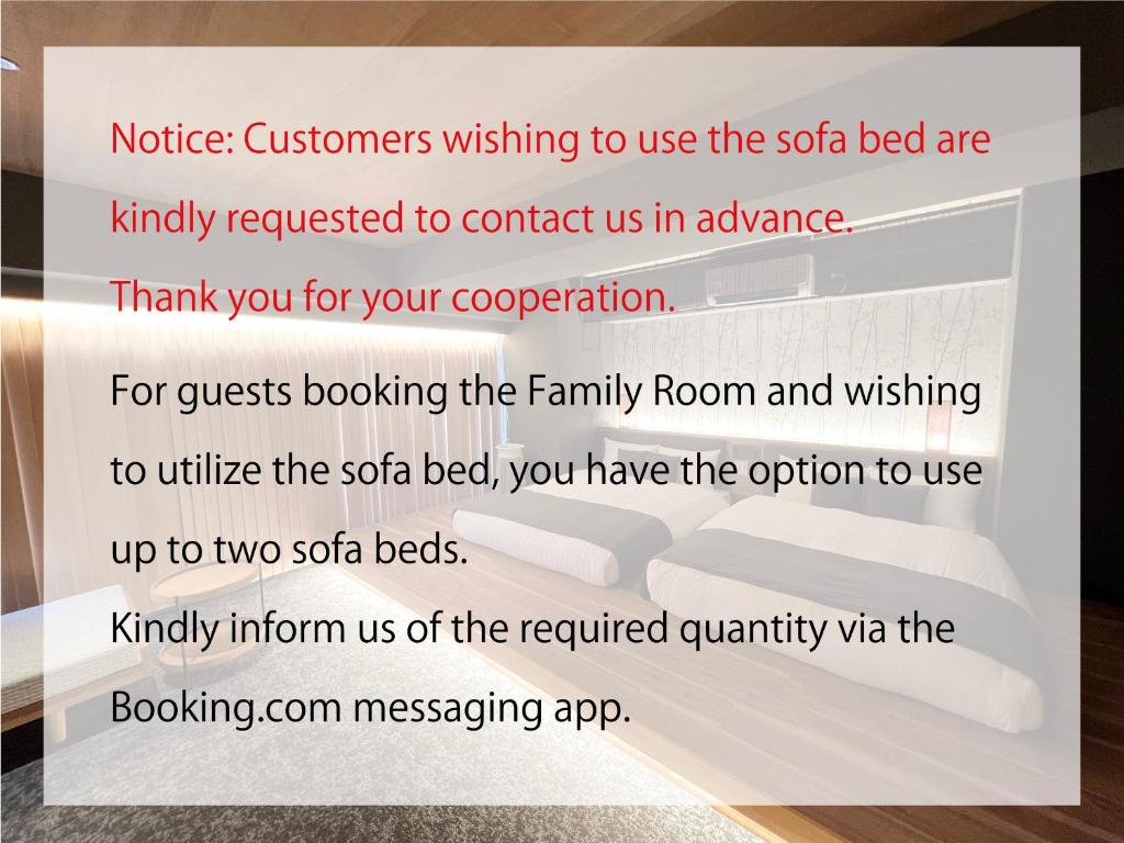 Postel nebo postele na pokoji v ubytování HOTEL TOMOS ASAKUSA
