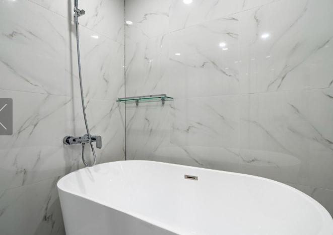 Koupelna v ubytování Reina Hotel
