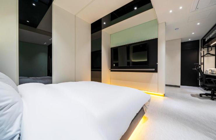Postel nebo postele na pokoji v ubytování Reina Hotel