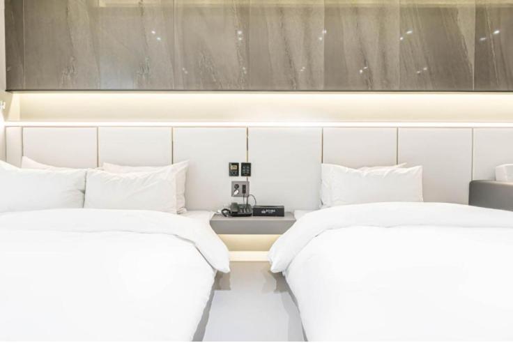 Postel nebo postele na pokoji v ubytování Reina Hotel