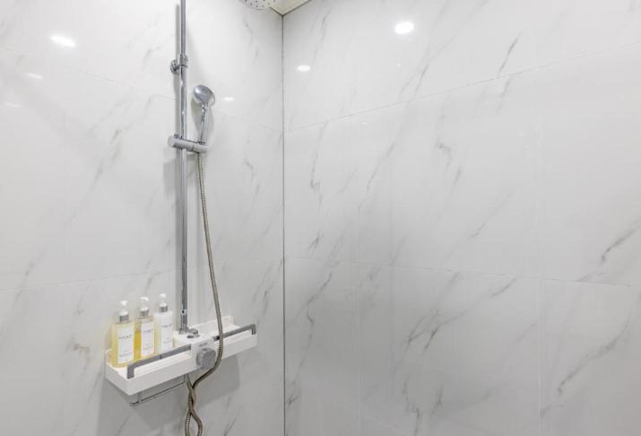 Koupelna v ubytování Reina Hotel
