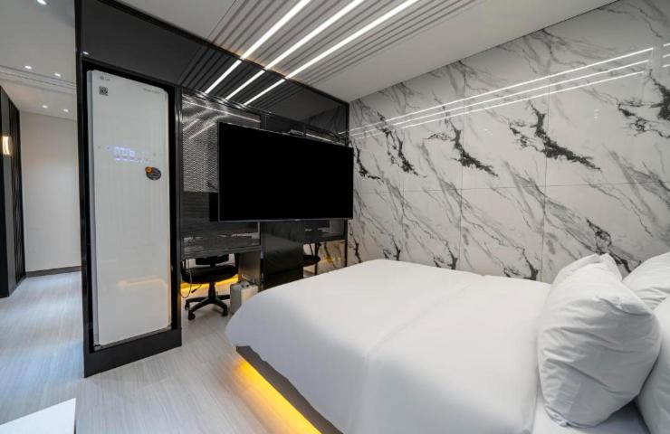 Postel nebo postele na pokoji v ubytování Reina Hotel