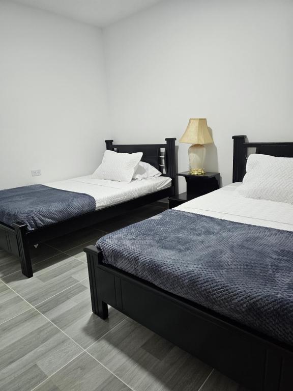 Postel nebo postele na pokoji v ubytování Zavara Hostal - Pueblo Tapao, 321-609-4407