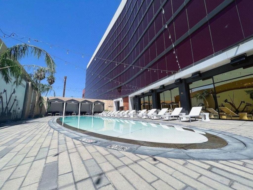 a swimming pool in front of a building at Ahern Hotel and Event Center in Las Vegas