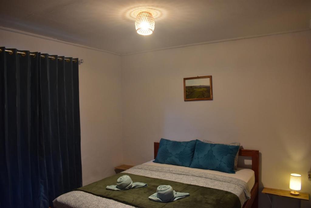 Postel nebo postele na pokoji v ubytování Mama's Homestay Ruteng