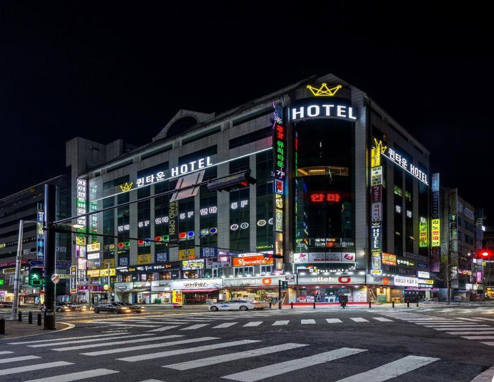 a large building with a hotel at night at Queen Town Ilsan in Goyang