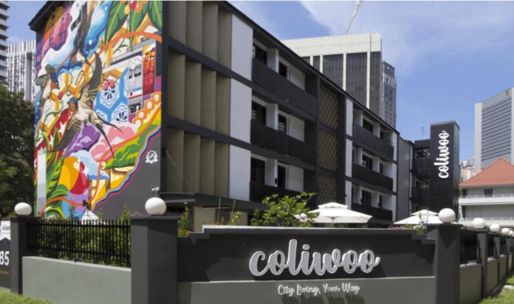 a building with a mural on the side of it at Coliwoo Keppel Serviced Apartments in Singapore