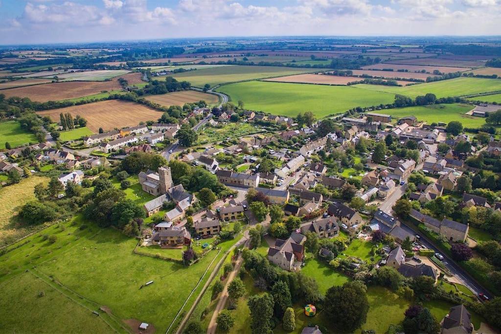 an aerial view of a small village with houses at One Bedroom Character Cottage in Farthinghoe