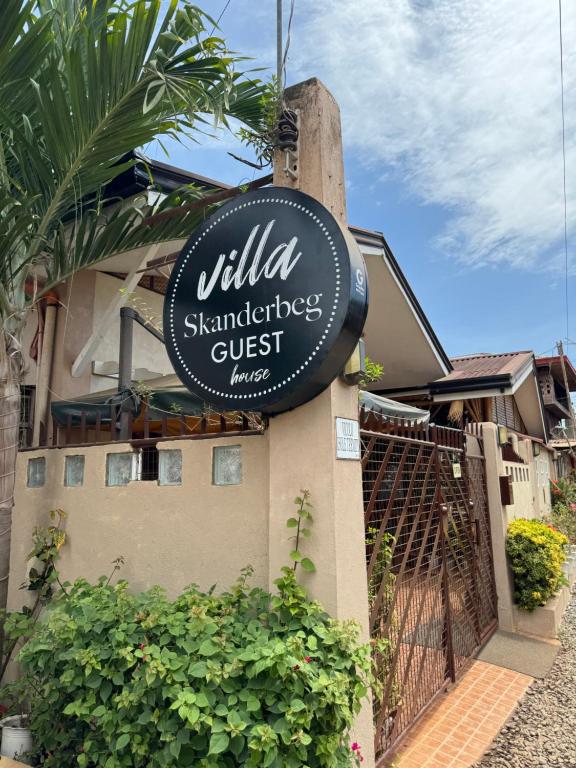 a sign for a villa shambles guest house at Villa Skanderbeg Guest House in Puerto Princesa City