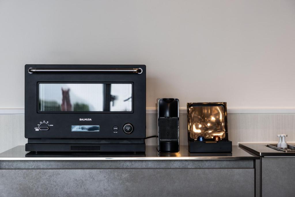 TV a/nebo společenská místnost v ubytování Class The First クラス ザ ファースト プライベートプール&サウナ
