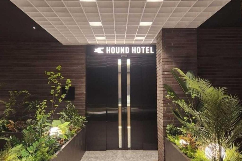 a lobby of a hotel with a sign that reads hound hotel at Hound Hotel Jeonju Deokjin in Jeonju