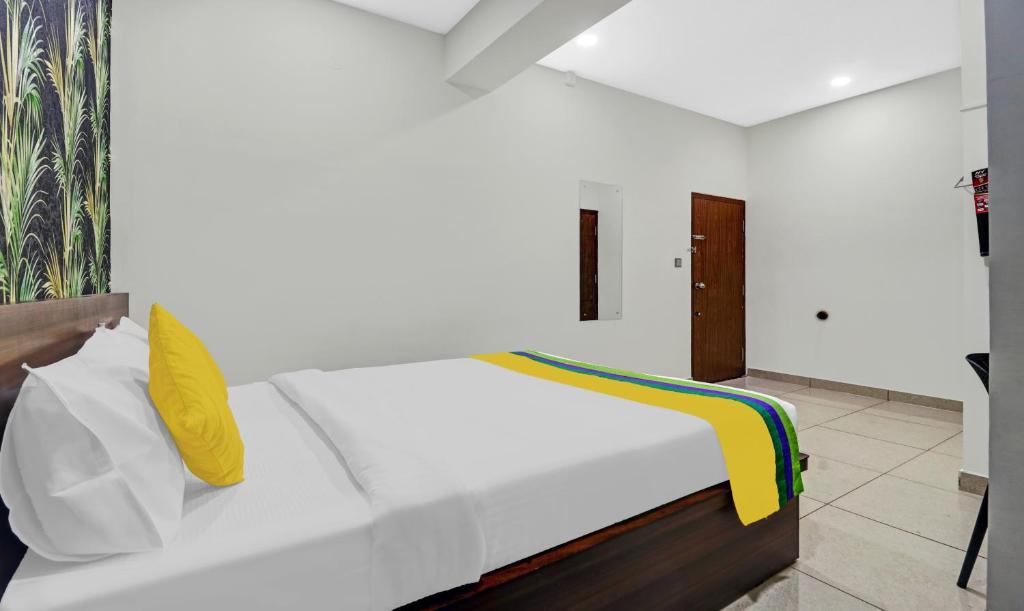 Postel nebo postele na pokoji v ubytování Hotel NRM Residency