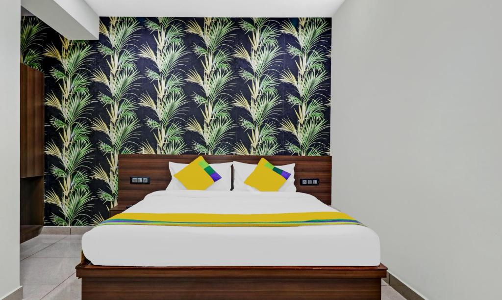Postel nebo postele na pokoji v ubytování Hotel NRM Residency
