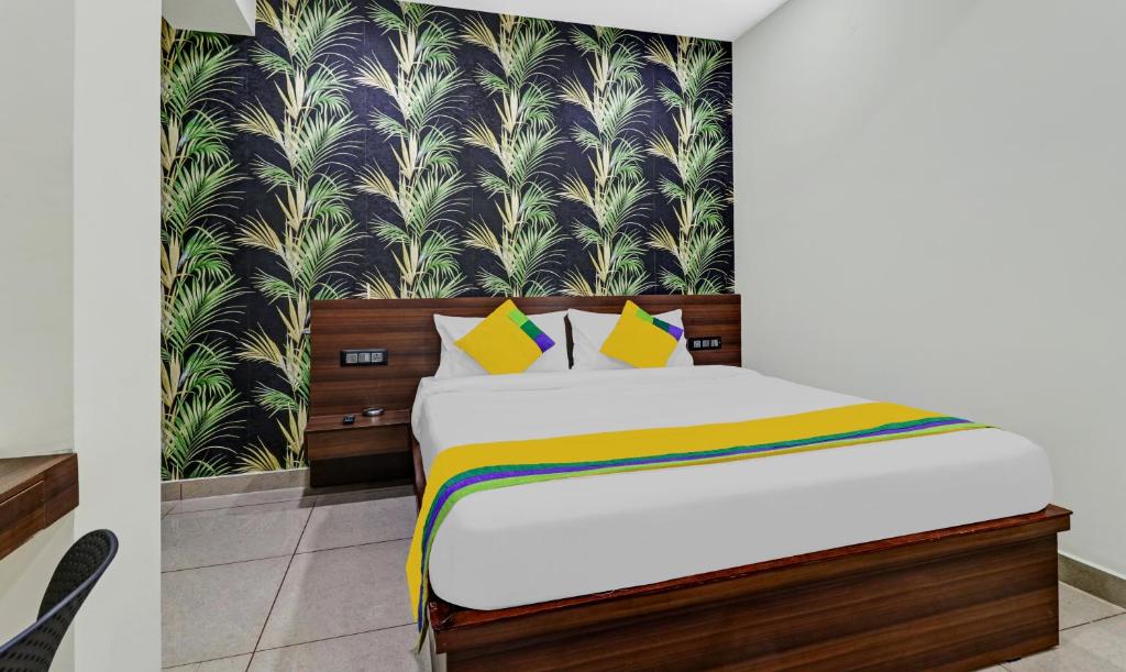 Postel nebo postele na pokoji v ubytování Hotel NRM Residency