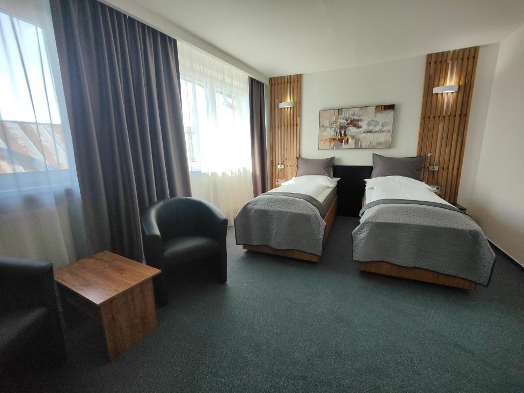 Voodi või voodid majutusasutuse Hotel P7 toas