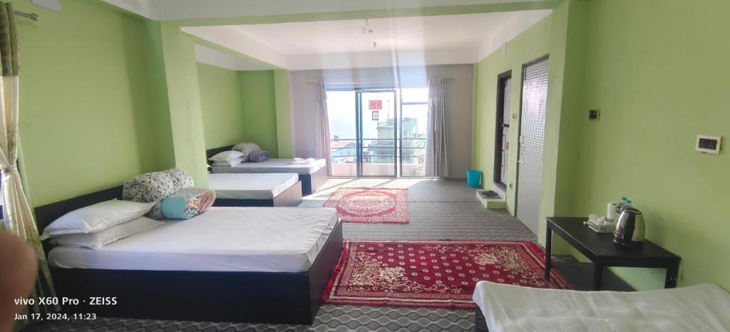 Letto o letti in una camera di Hotel TAMU ilam
