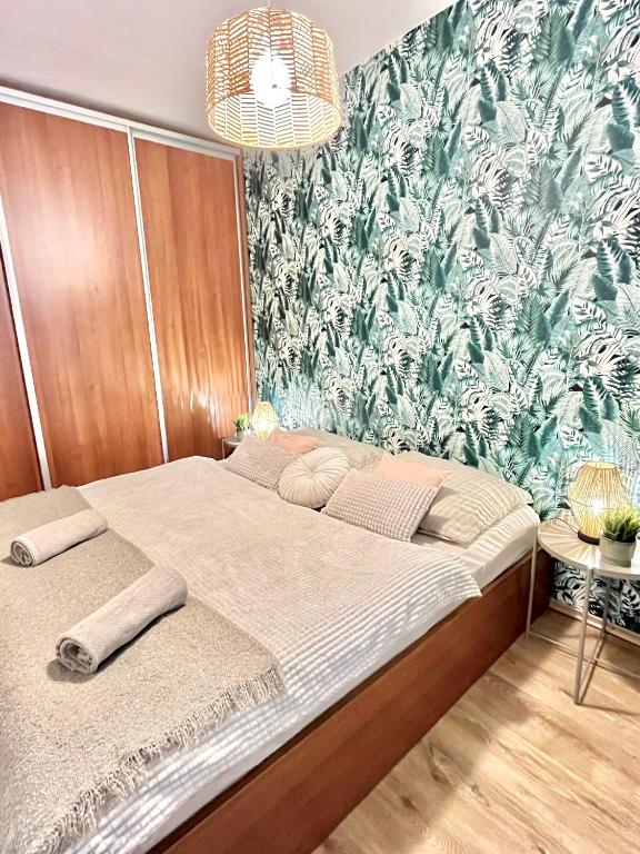 A bed or beds in a room at URBAN JUNGLE Apartment old town Air Conditioned
