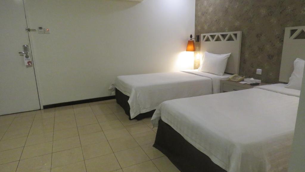 Postel nebo postele na pokoji v ubytování Heritage Hotel