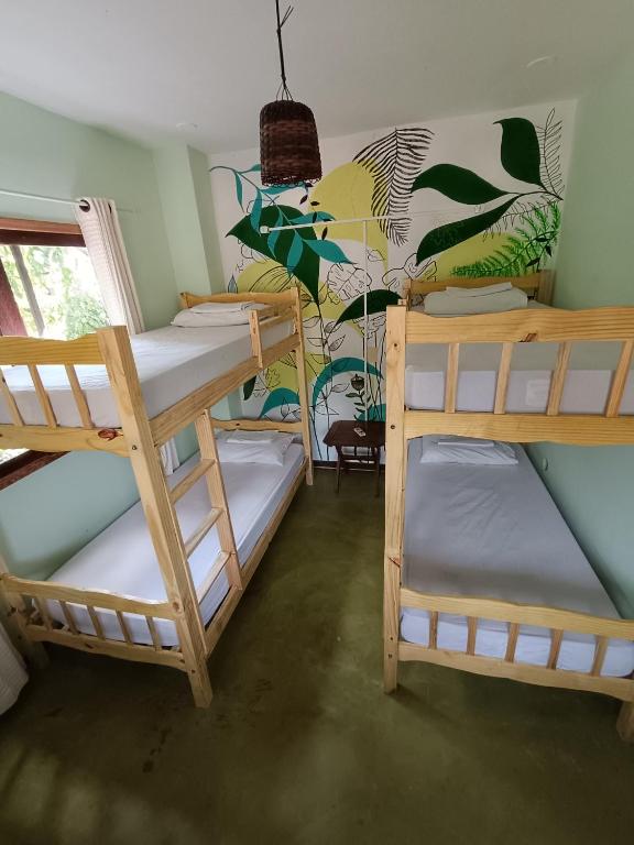 Postel nebo postele na pokoji v ubytování Ôxe Uai Hostel