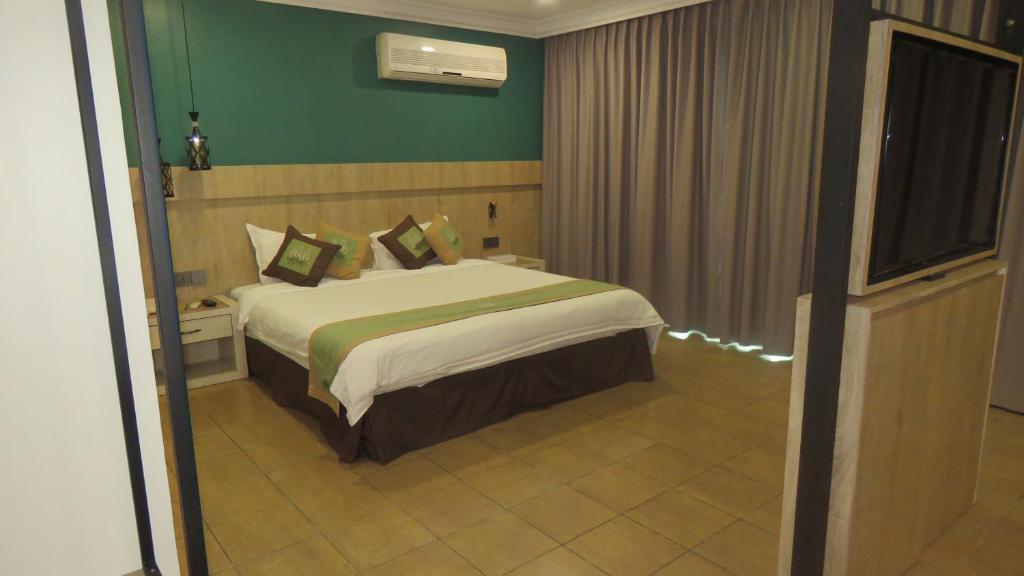 Postel nebo postele na pokoji v ubytování Heritage Hotel
