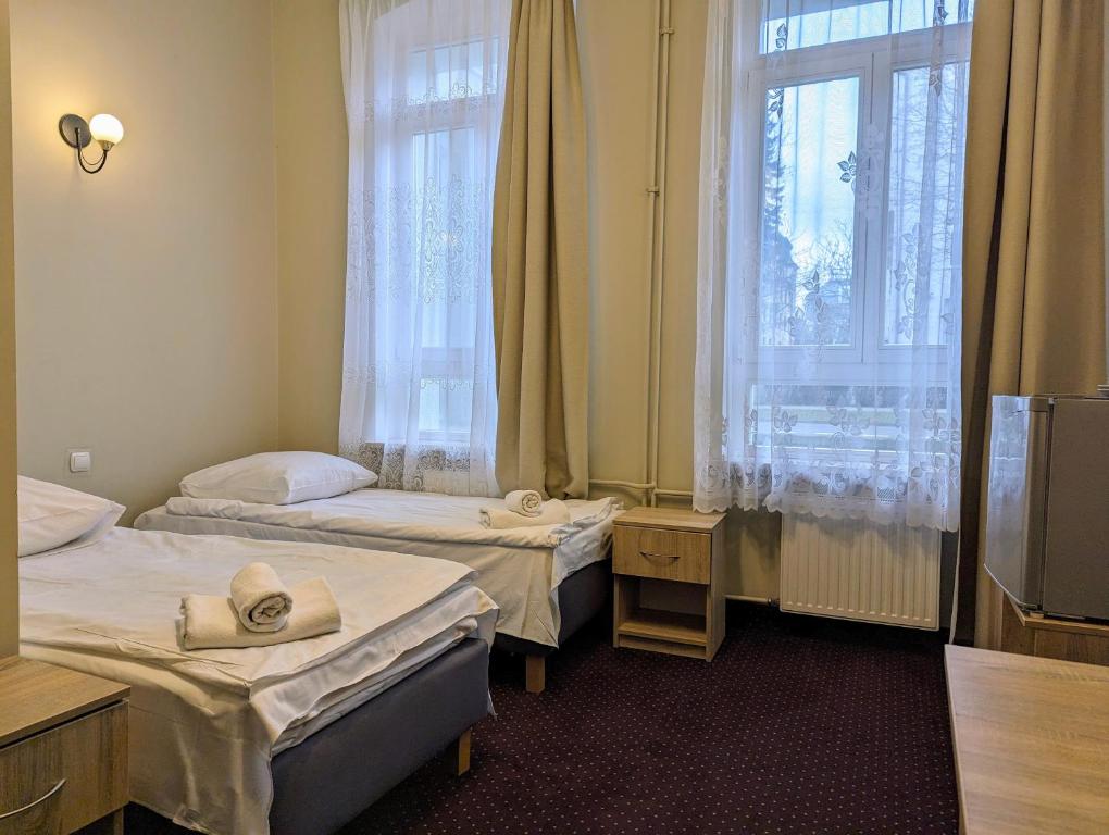 Postel nebo postele na pokoji v ubytování OSW Świnoujście Rybitwa