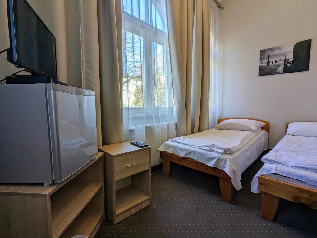 Postel nebo postele na pokoji v ubytování OSW Świnoujście Rybitwa