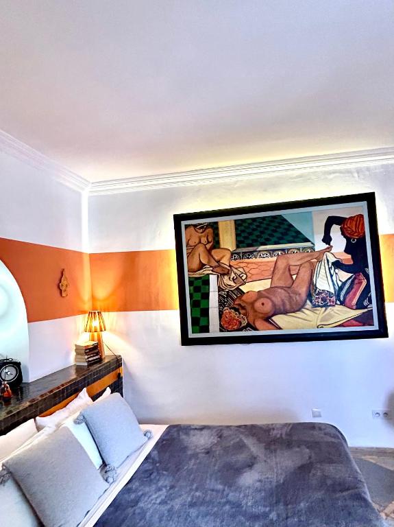 Postel nebo postele na pokoji v ubytování Riad Lauriers Blancs