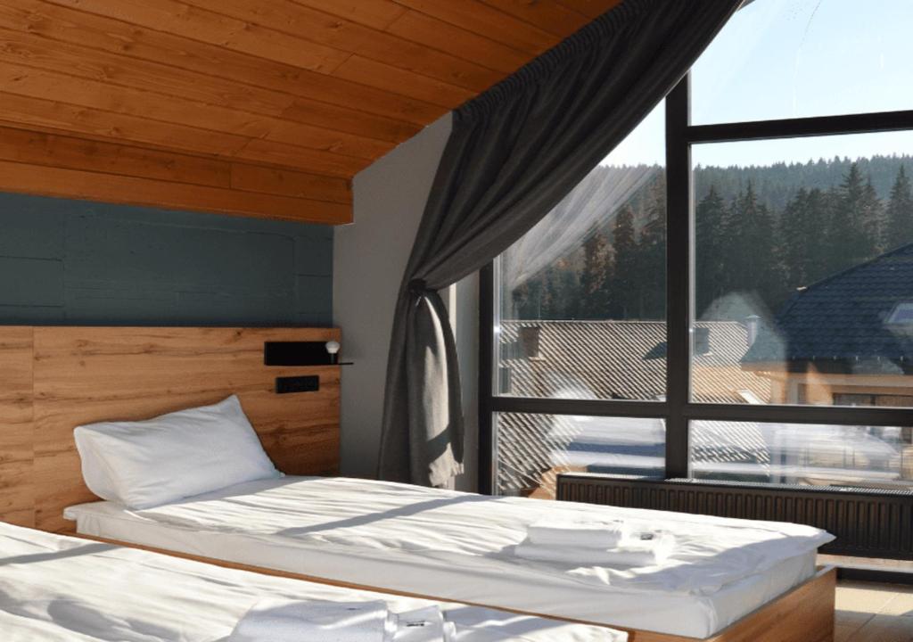 Voodi või voodid majutusasutuse Baza Smart Hotel toas