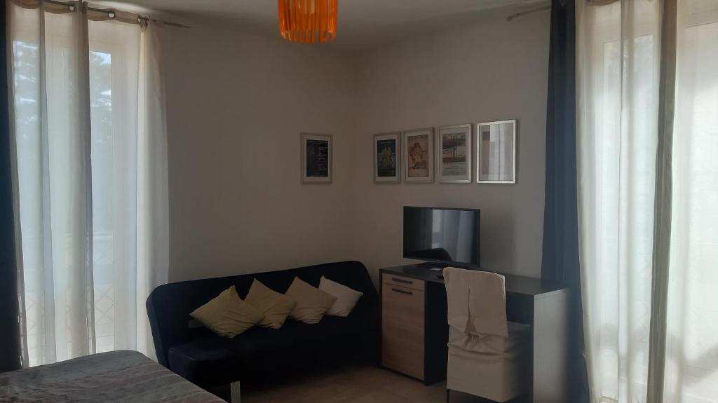 TV a/nebo společenská místnost v ubytování Casa Antioco B&B