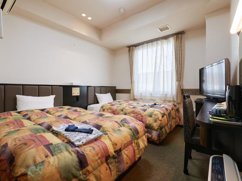 TV a/nebo společenská místnost v ubytování Gamagori Hotel
