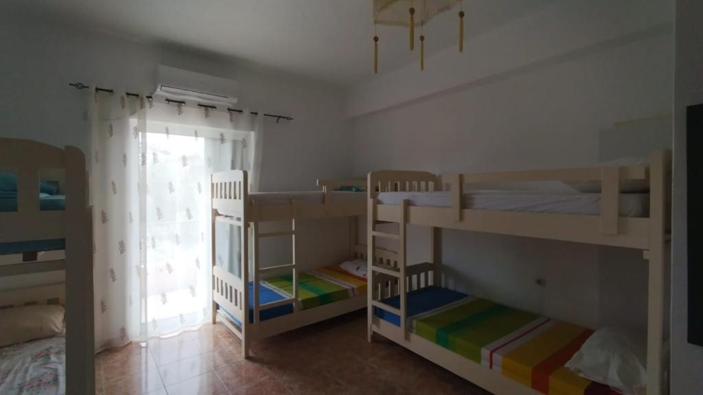 Postel nebo postele na pokoji v ubytování Oasis Hostel