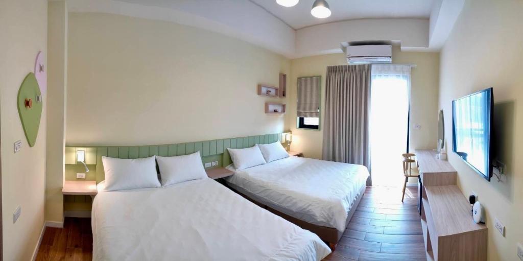 Postel nebo postele na pokoji v ubytování Mi Hai B&B