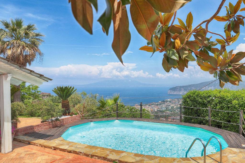 a swimming pool with a view of the ocean at Villa Giulia in SantʼAgata sui Due Golfi