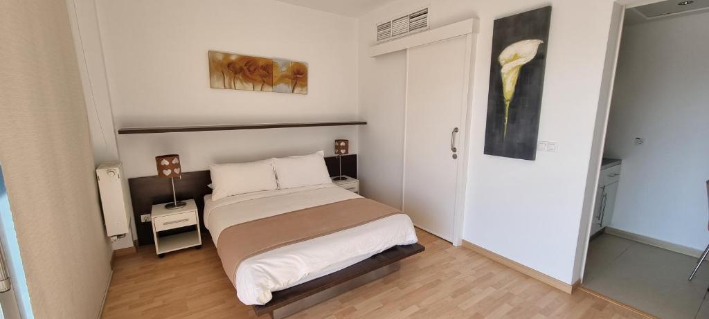 Postel nebo postele na pokoji v ubytování Sky Suites