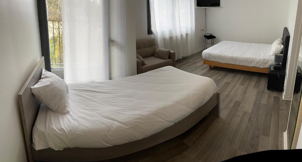 Postel nebo postele na pokoji v ubytování Hotel Restaurant Rolland