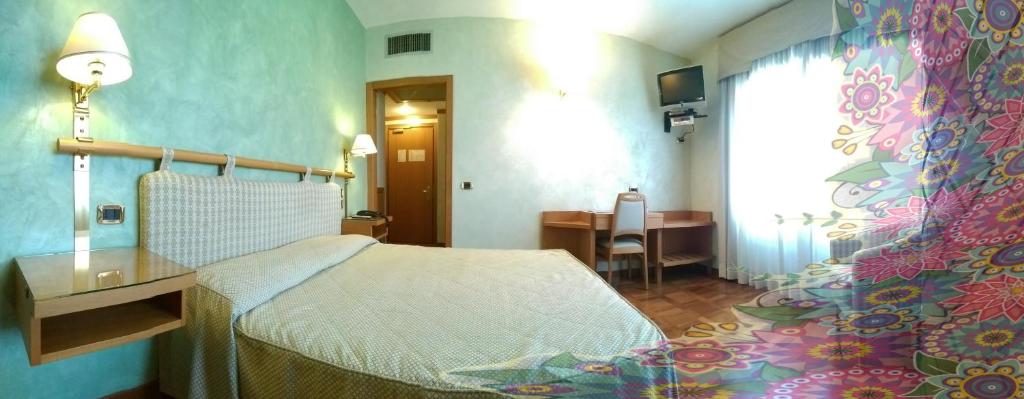Postel nebo postele na pokoji v ubytování Hotel Meeting
