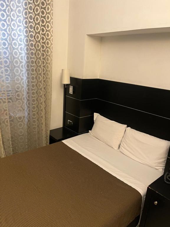 Postel nebo postele na pokoji v ubytování Hotel Sonya