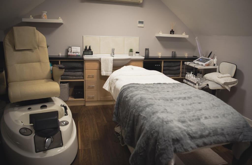 a hospital room with a bed and a sink at Headfort Arms Hotel in Kells