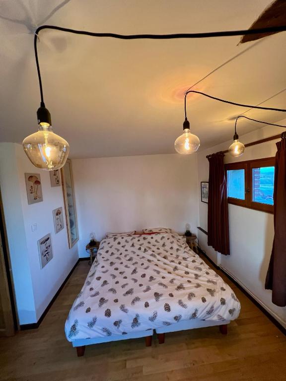 Postel nebo postele na pokoji v ubytování Les Garennes
