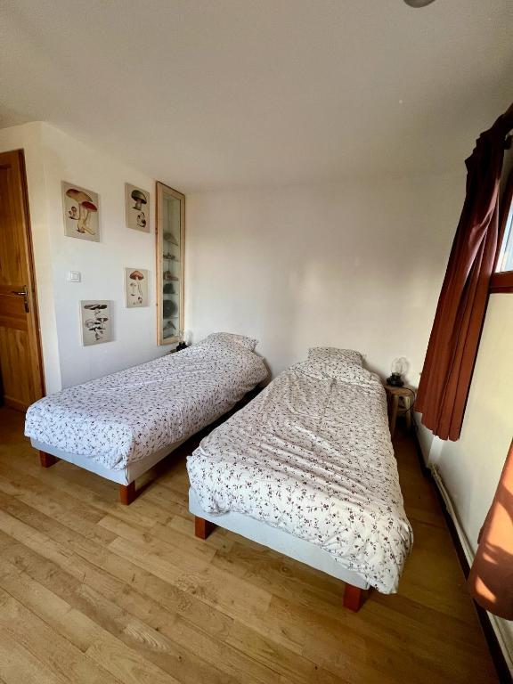 Postel nebo postele na pokoji v ubytování Les Garennes
