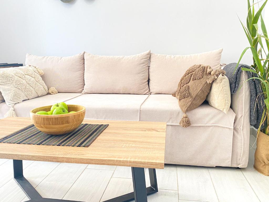 a living room with a couch and a coffee table at Nikol's House in Chania