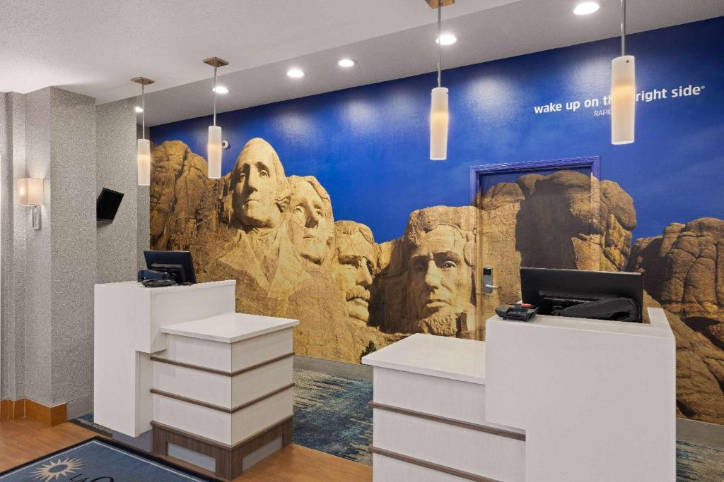 a room with a wall with a mural of rocks at La Quinta Inn and Suites by Wyndham at WaTiki Waterpark in Rapid City